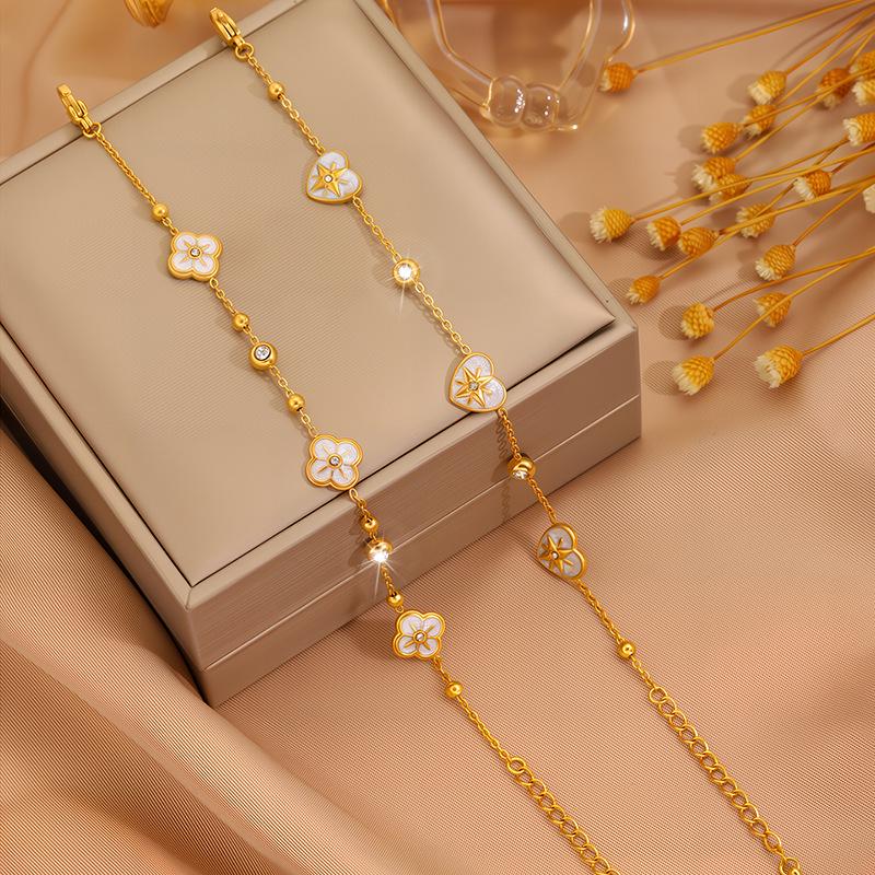 Elegant Women's Titanium Steel Bracelet with Diamond-Embedded Four-Leaf Clover and Eight-Pointed Star Design