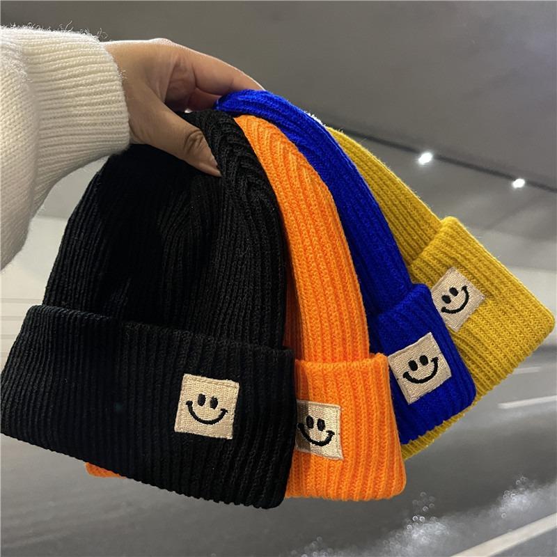 Cute smiley face label wool hat women's autumn and winter warm trend versatile ear protector black knitted hat men