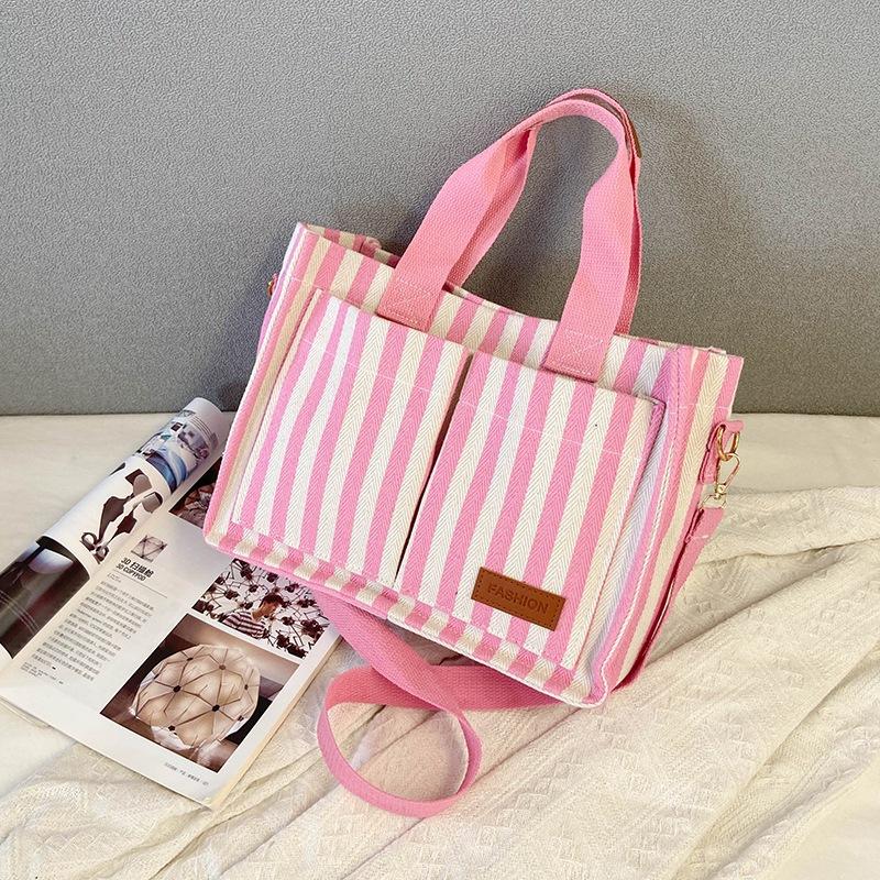 

New commuter large-capacity popular striped canvas casual fashion personalized portable messenger tote women s bag розовый