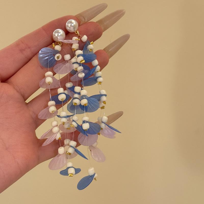 

Seaside vacation wind silver needle shell pearl fringed earrings, high-end exaggerated earrings, unique and beautiful temperament earrings