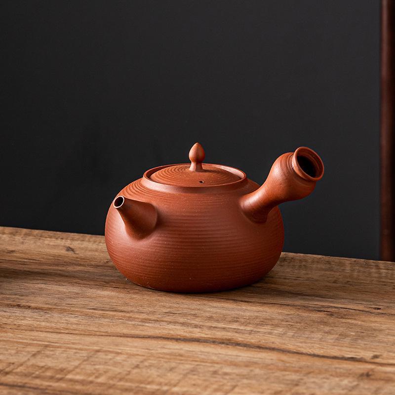 Ceramic Kung Fu Tea Set: Black Teapot with Side Handle and Charcoal Stove for Open Fire.