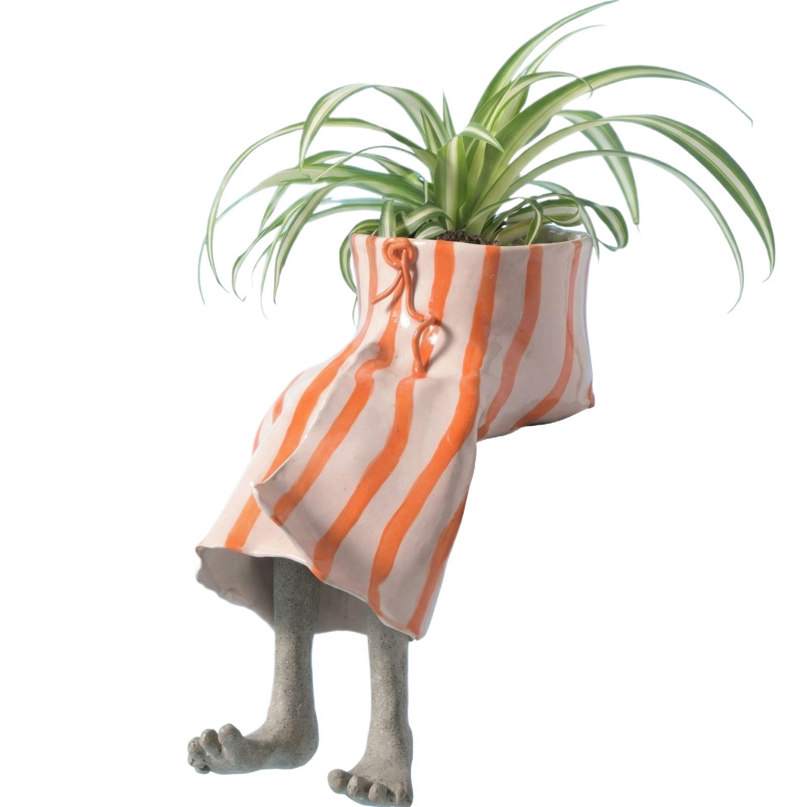 

This Uniquely Designed Resin Flowerpot With Its Distinctive Lower Half Will Become A Highlight In Your Home, Garden, Patio, Or Decor.