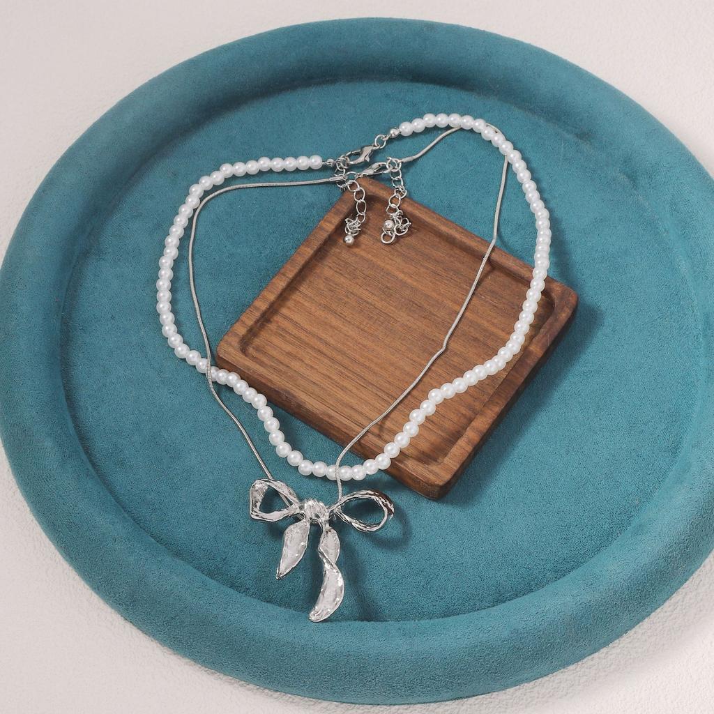Light luxury imitation pearl fashion one more wear personalized metal bow pendant women's necklace