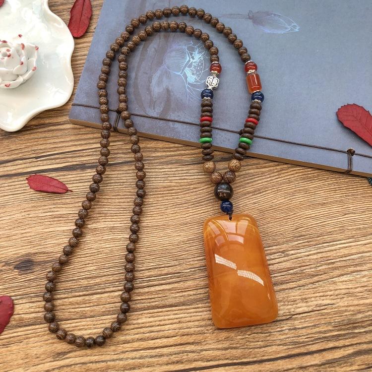 Retro chicken wing wood second generation old beeswax necklace men and women versatile amber pendant long sweater chain pendant