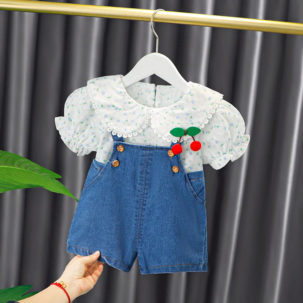 

Summer Cute Floral Toddler Girl Two-piece Set: Short Sleeve T-shirt and Overalls Shorts 90 cm джинсовий синього кольору