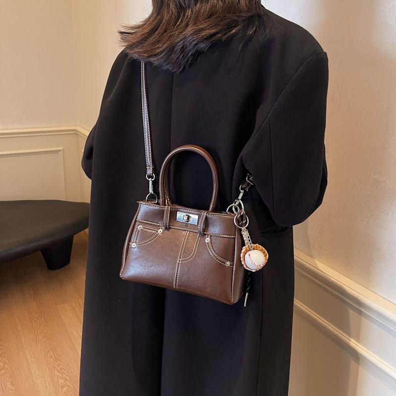 

New bag women s 2025 bucket bag autumn and winter niche design retro shoulder crossbody women s handbag 24*10*15 темно-коричневого кольору