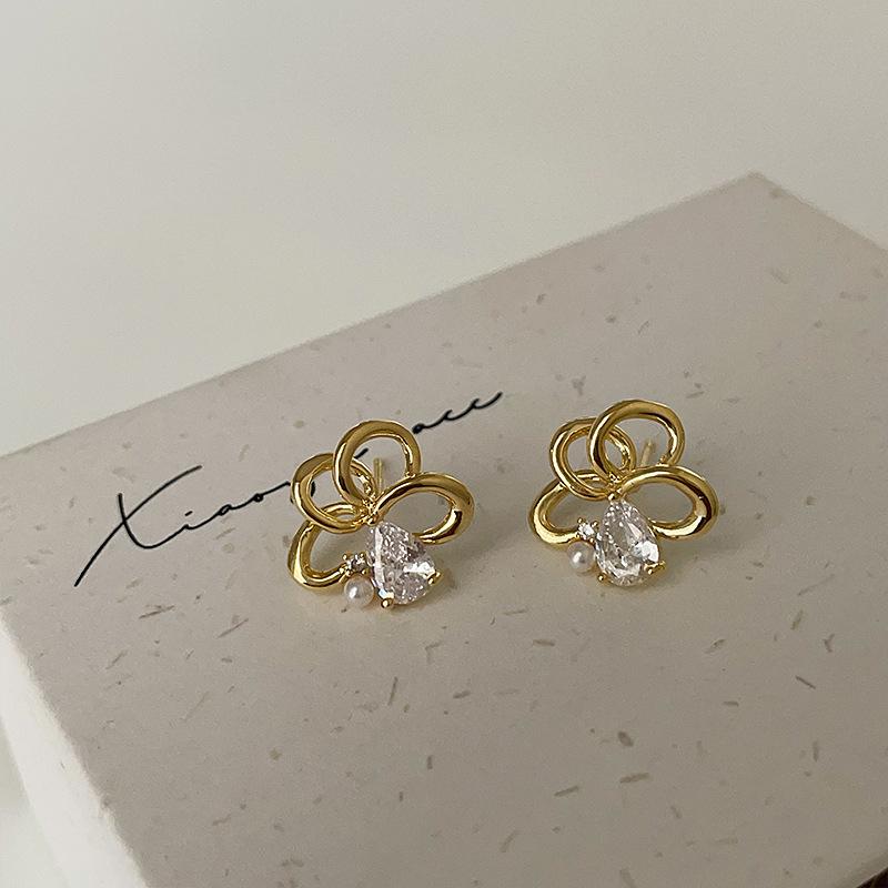 

Серьги-гвоздики с полым цирконием и металлическим цветком, женские, уникальные, высокого класса, с чувством индивидуальности, элегантные, универсальные серьги