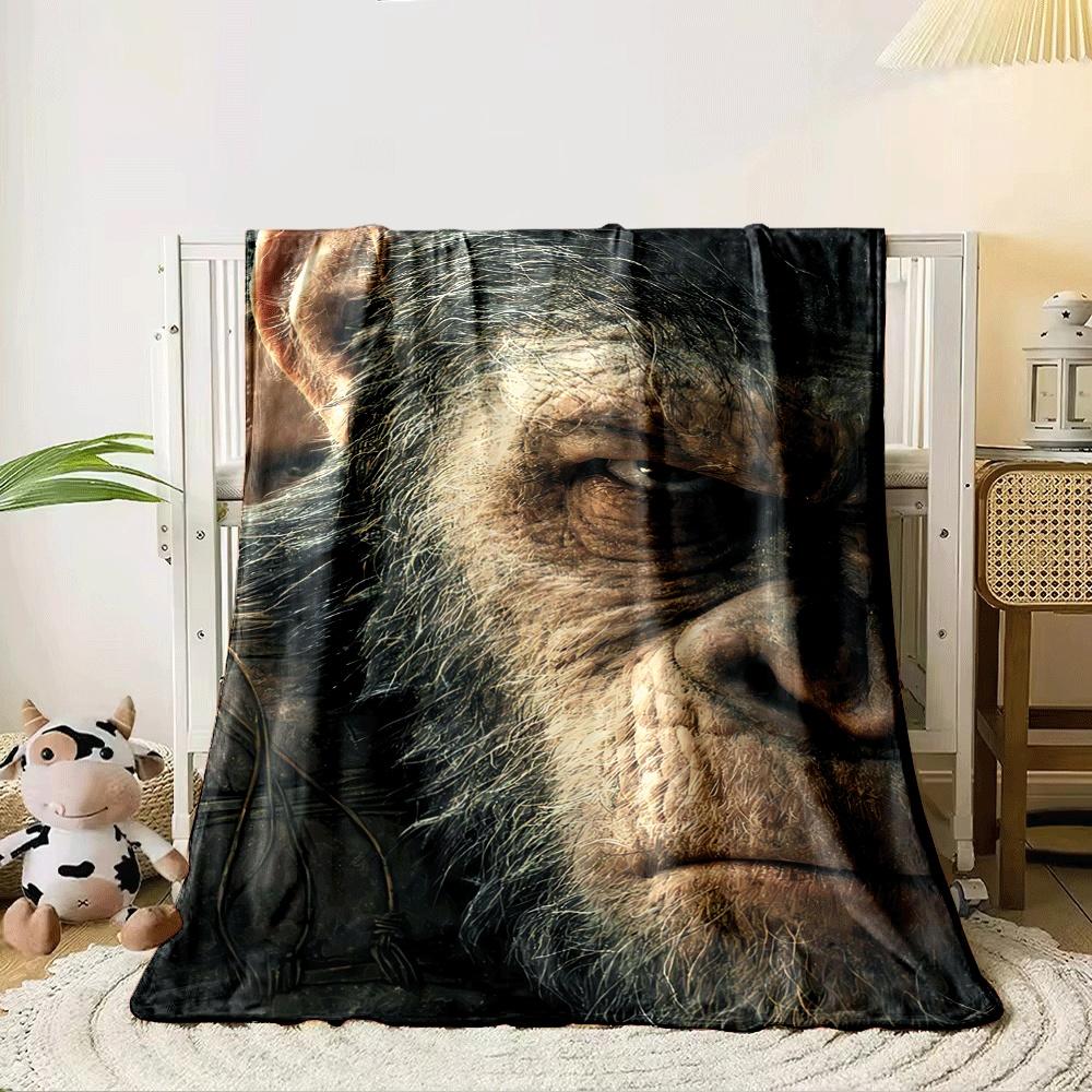 Close-up of a detailed, intense ape face with visible texture and fur. for all seasons blanket lunch break throw gift 80cm x 120cm