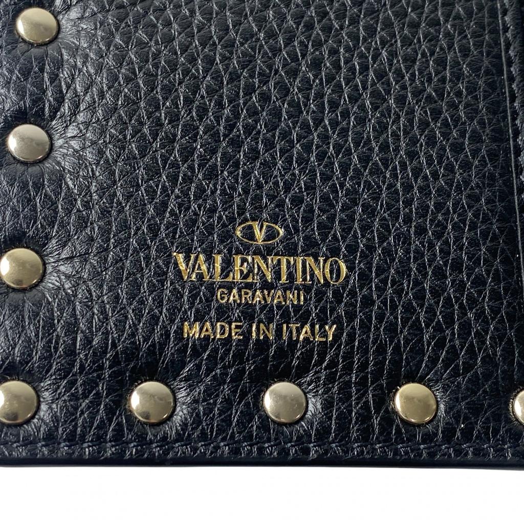 Carteira Bifold Valentino Garavani usada couro preto/dourado Mulher