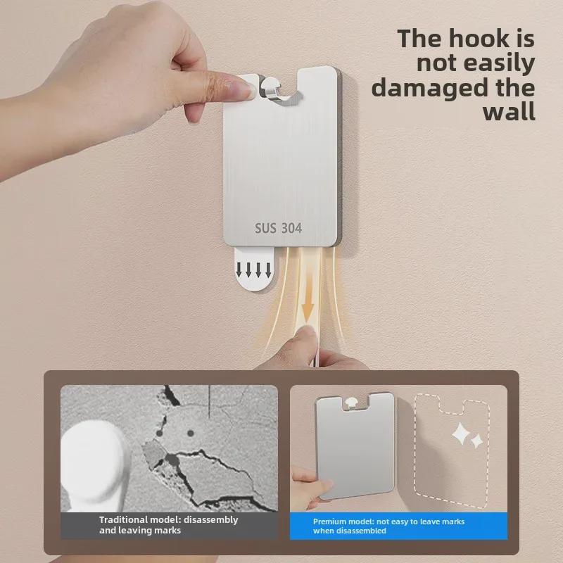 Spårlös väggkrok för foton och målningar