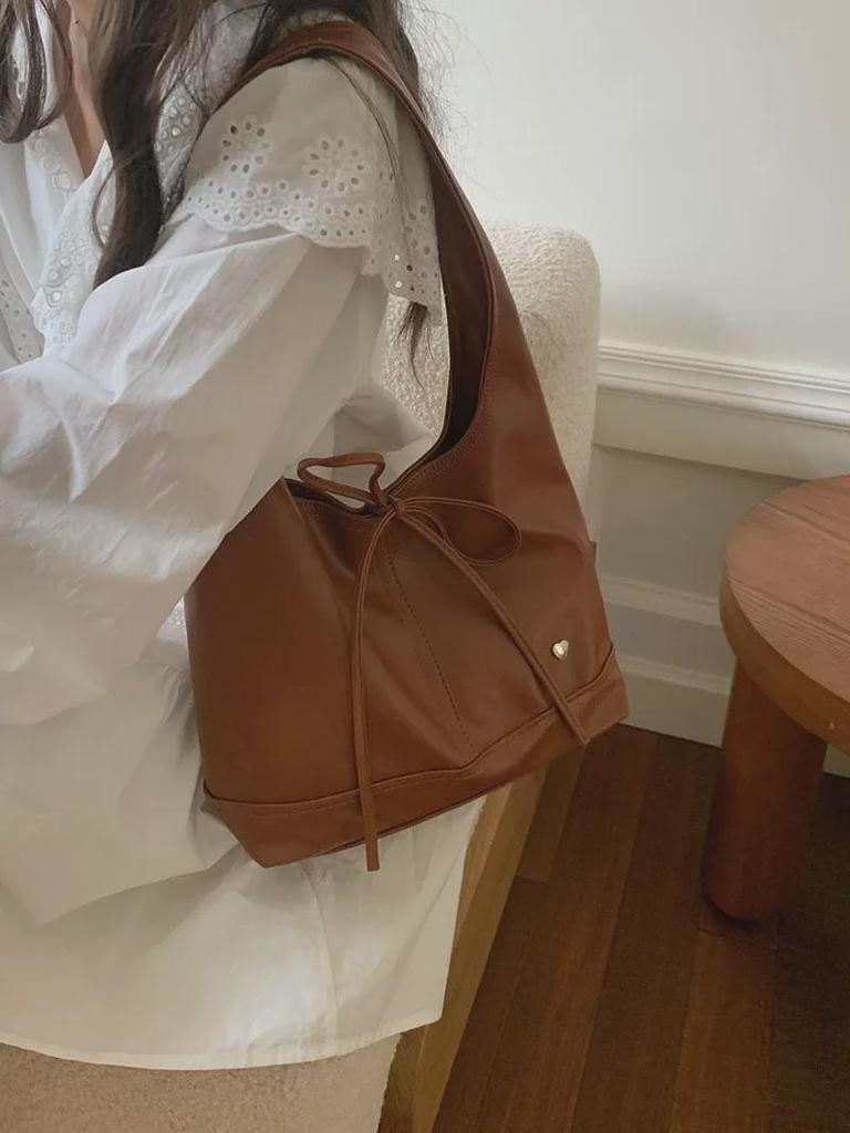 2025 Korean Niche Vielseitige Pendlertasche für Damen: Großes Fassungsvermögen, lässig mit französischem Bogen-Schulterdesign