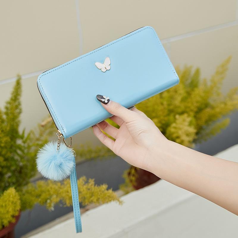 New solid color butterfly label wallet women's long zipper clutch bag hairball simple change bag one piece hair