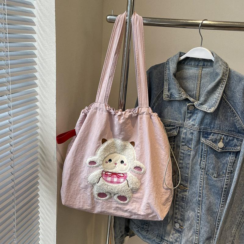 

Large capacity lazy wind tote bag women s 2025ins versatile literary class bag cute embroidered shoulder bag No specification