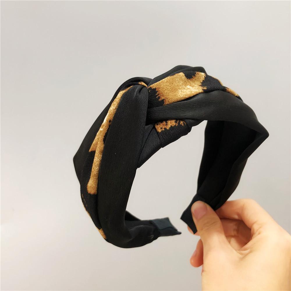 A unique leopard print color-blocked knotted headband with a goddess-like charm and a trendy fabric wide headband