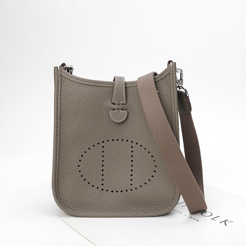 Factory wholesale first layer togo cowhide bucket bag women's bag lychee pattern hollow single shoulder crossbody bag hollow design