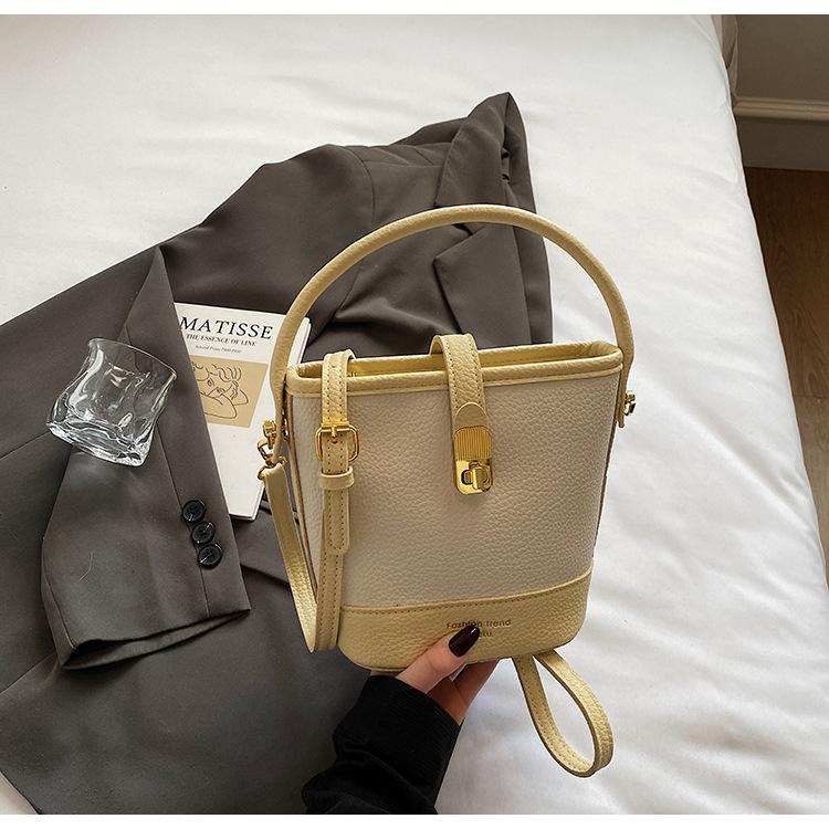 High-end niche contrasting color small bucket bag women's 2025 new Korean version fashion one-shoulder portable messenger bag