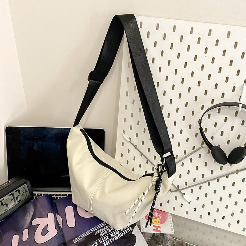 Lichtgewicht veelzijdige canvas tas dames nieuwe zomer populaire schoudertas niche schouder knoedeltas