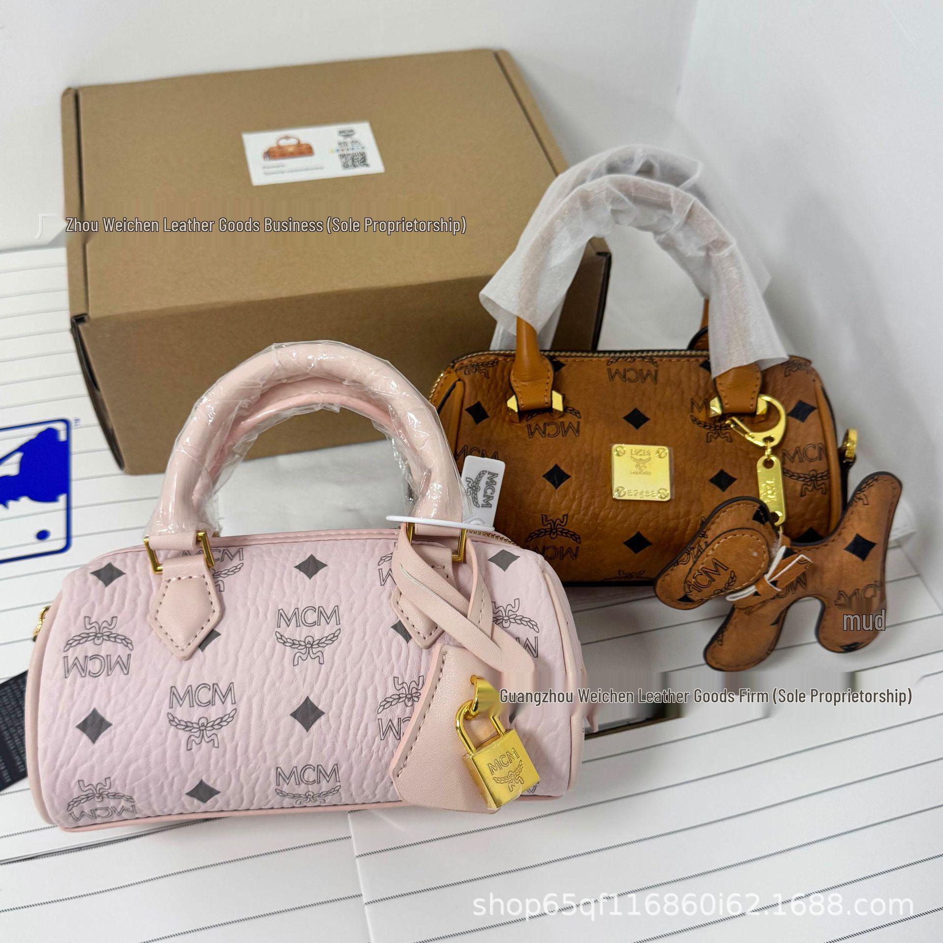 

Жіноча міні-сумка Boston із золотим замком, класичний принт, сумка-подушка через плече - Модна та універсальна жіноча циліндрична сумка для носіння в руці Cognac Gold Lock