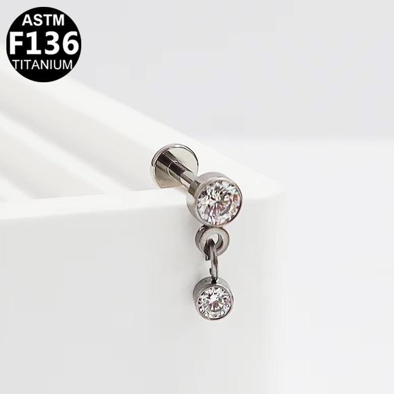 G23 Titanium Cartilage Stud with Zircon Chain and Lightning-Inlaid Titanium Lip Stud.
