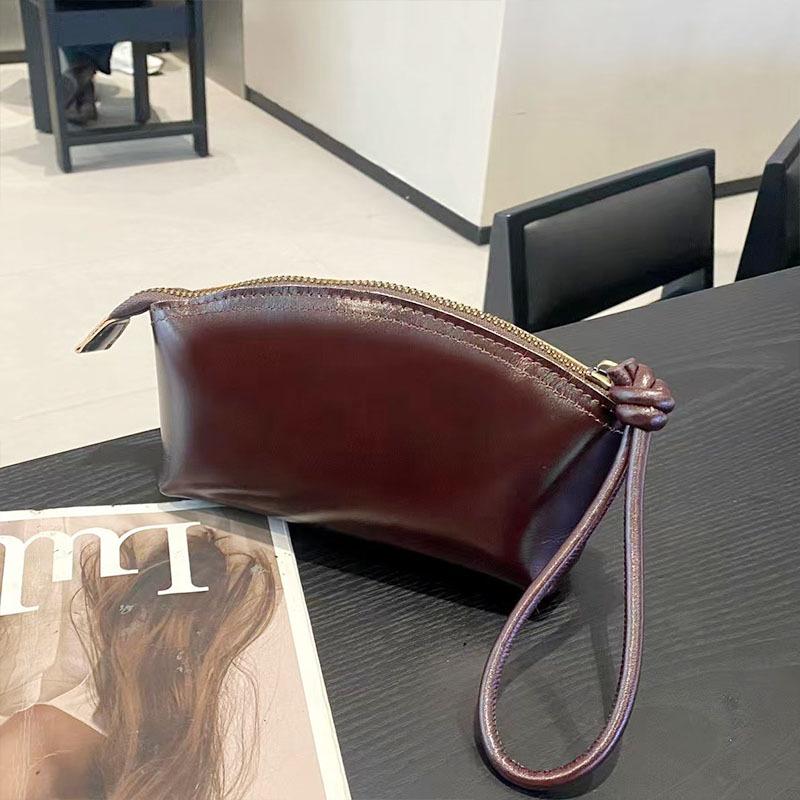 Handheld wallet New leather casual dinner bag First layer cowhide cosmetic bag Fashion versatile women's bag