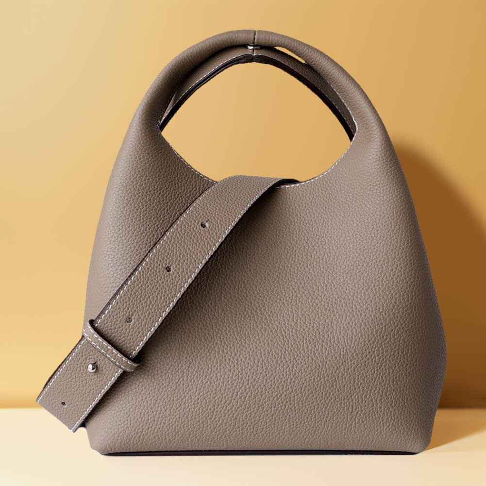 

Сумка через плече з натуральної шкіри. М’яка сумка-відро. Модна жіноча сумка з двостороннім дизайном і регульованим ременем. Жіноча сумка з верхньою ручкою. сірий