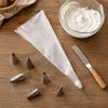 34-Piece Stainless Steel Cake Decorating Nozzle Set with Silicone Piping Bags and Scrapers for DIY Baking and Pastry Decoration
