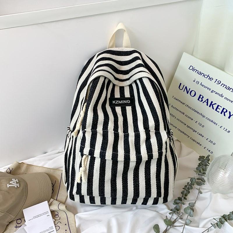 High-value college style striped backpack for junior high school students, casual, simple, lightweight and large-capacity backpack.