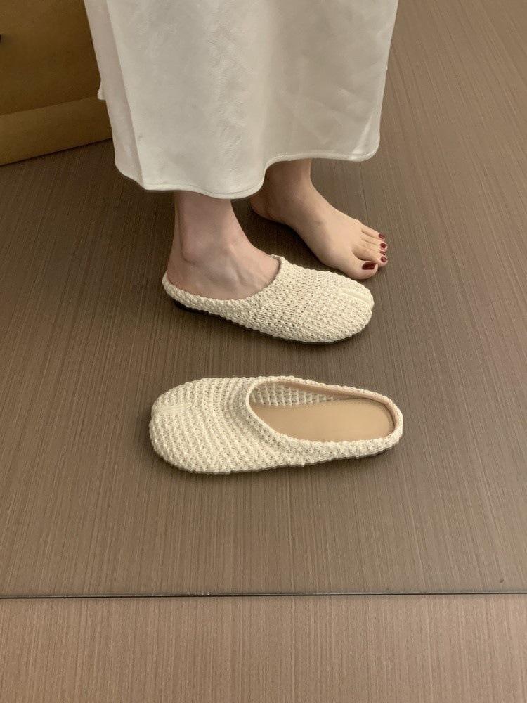 

French evening wind woven bag head half slippers women s summer wear 2025 new sub-toed pig s trotters sandals flat-soled Muller shoes 40