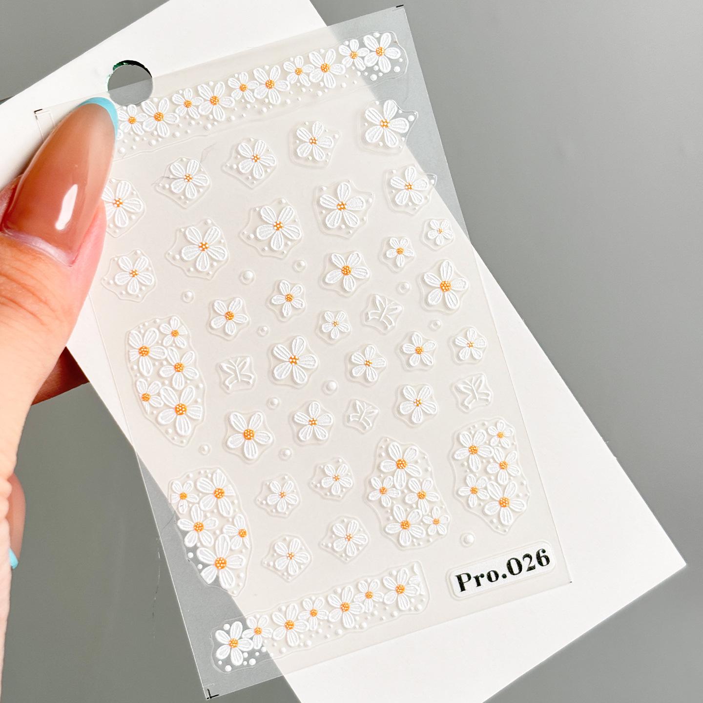 White Daisy Stickers: Fresh, 3D Embossed Floral Nail Art Decorations with Adhesive Backing.