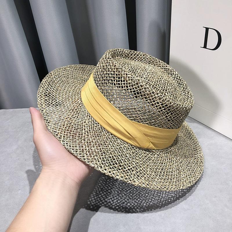 Travel Natural seagrass hollow flat brim hat ladies summer porkpie concave round sun hat beach straw hat with ribbon sale