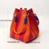 This multi-color knitted retro bucket handbag is simple and color-blocked, versatile and easy to carry with you