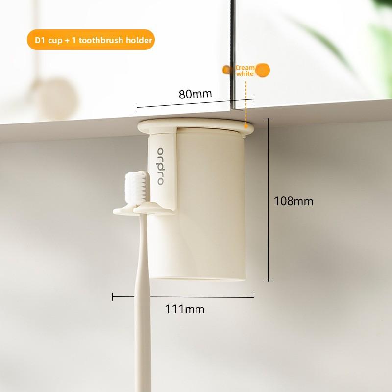 Under The Mirror Cabinet, There Is A Toothbrush Rack That Does Not Require Drilling and Is Hung Upside Down To Drain Water Cup holder