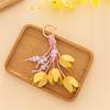 Artistic Tulips Themed Key Accessory Crafted From Leather With Elegant Bead Embellishment