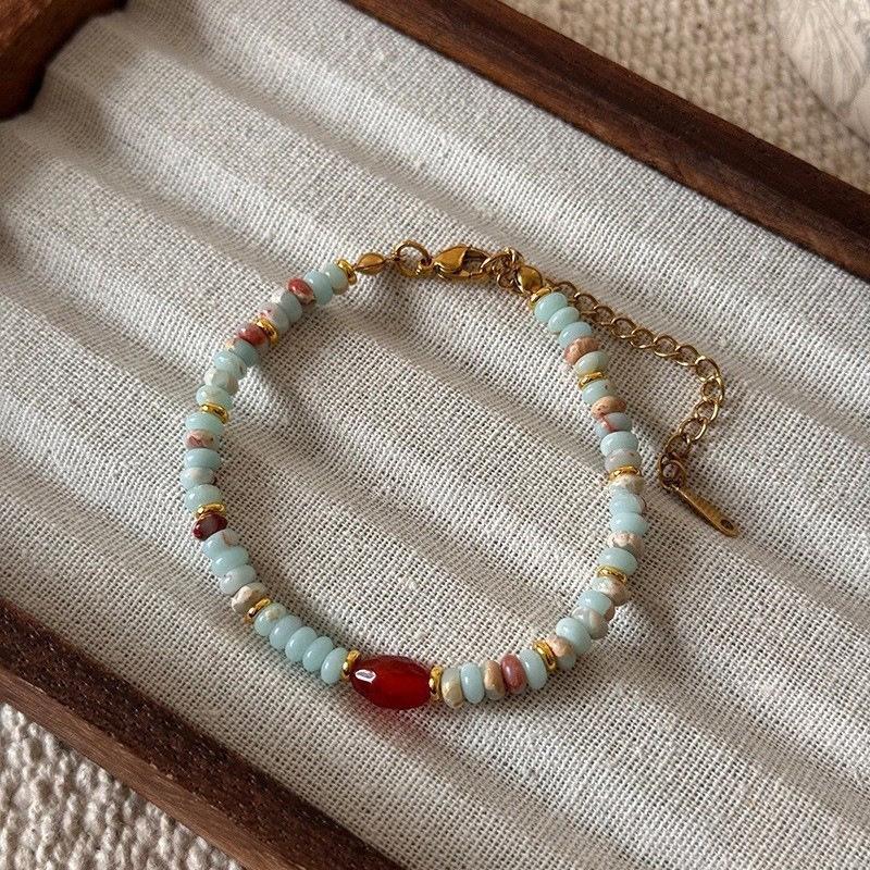 

Роскошный двухслойный браслет из пресноводного жемчуга и разноцветного шоушаньского камня