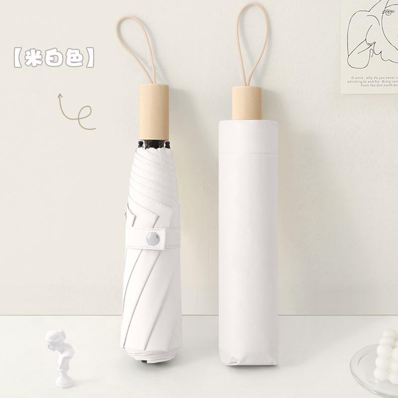 New three-fold simple plain color windproof and sun protection creative solid wood handle female vinyl parasol