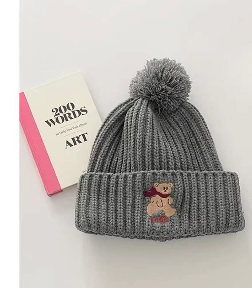 Cute bear embroidered knitted wool hat for children to keep warm in winter, thickened ear protectors, hairball cold hat to show small face