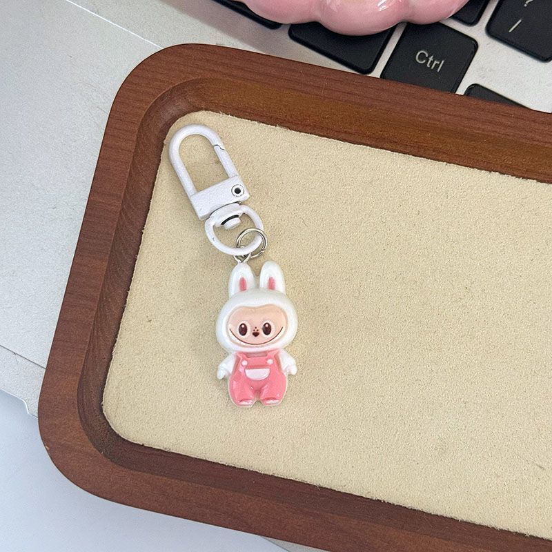 Niedliche Latzhose zum Hochziehen Anhänger Niedlich Cartoon Studenten Tasche Anhänger Geschenk