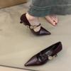2025 new pointed temperament metal buckle one-word strap high heels light mouth low heel French commuter black single shoes women