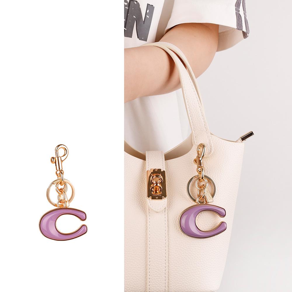 

Elegant Handbag Pendant: Pearl & Zircon Charm Keychain