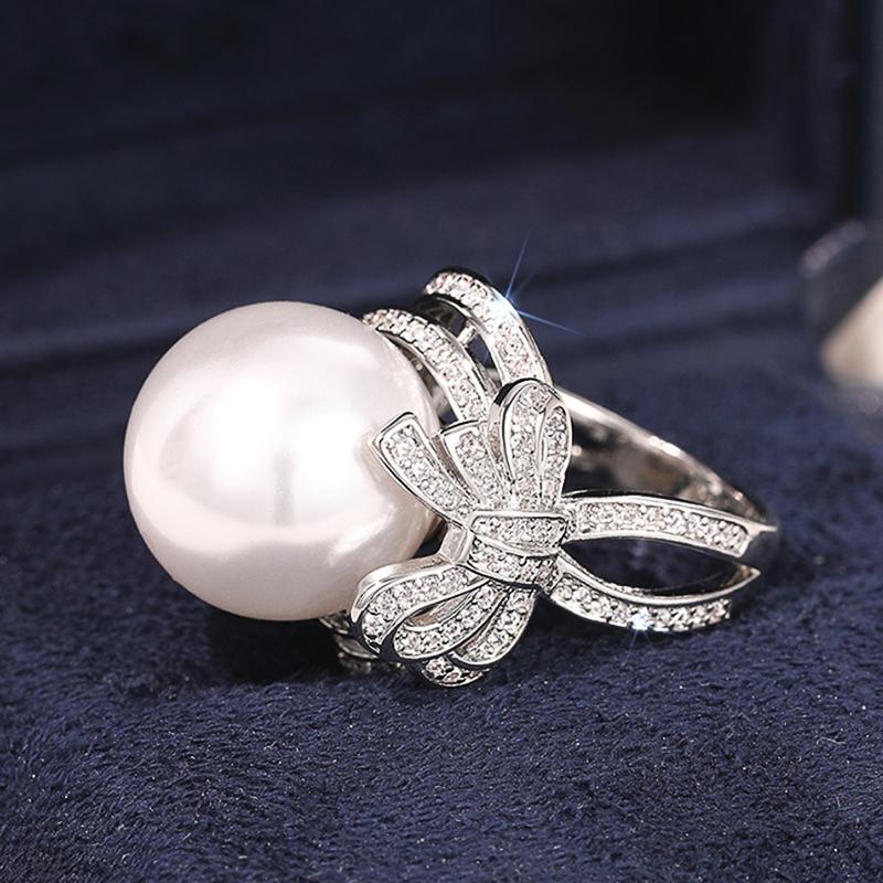 

Huitan Sweet Bow Imitation Pearl Women Rings for Engagement Wedding Luxury Trendy New Female Rings Temperament Lady s Zircon 6