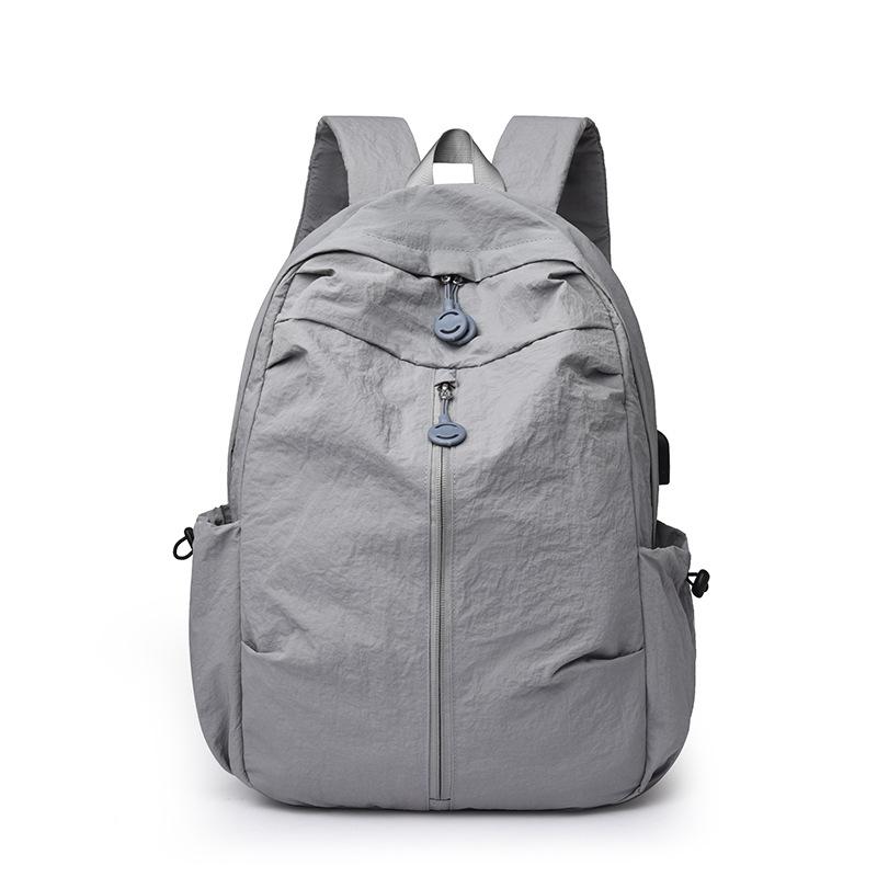 

Simple and Lightweight Student Schoolbag Men s and Women s Backpack for Work, Commuting and Business Trips, Travel Bag сірий колір