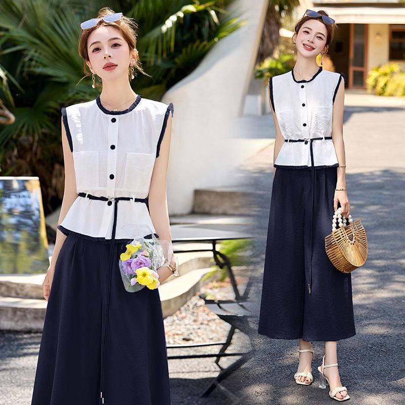 

Новый женский летний комплект 2025 года: топ на шнуровке с цветными блоками и юбка миди XL (60-68 kg) тёмно-синий