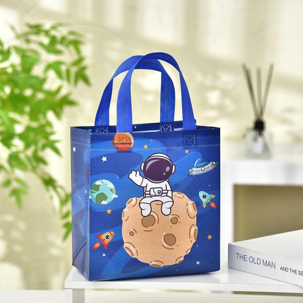 

The New Non-woven Fabric Printed Handbag Astronaut Cartoon Print Portable Shopping Pouch Large Capacity Candy Gift Bag