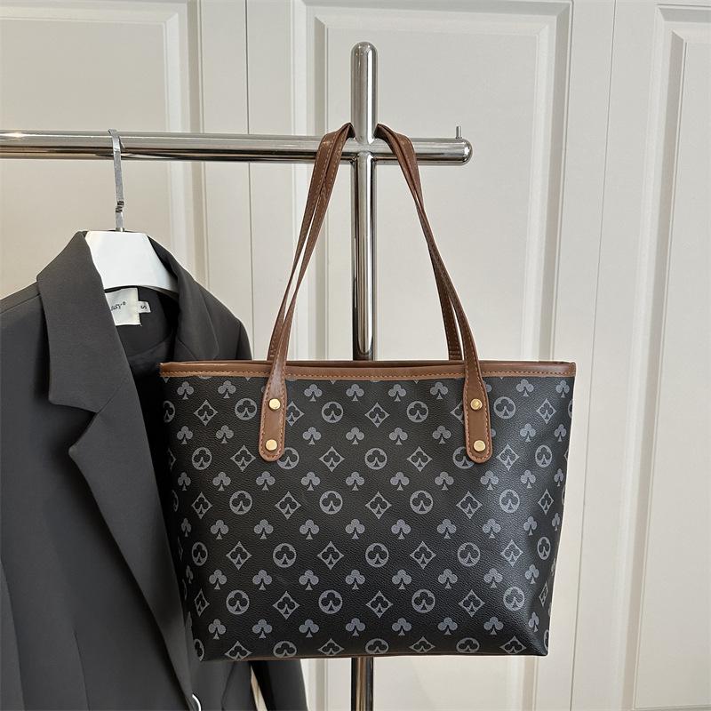 

Women s bag textured large-capacity bag niche versatile commuter bag women s new simple portable tote bag чёрный