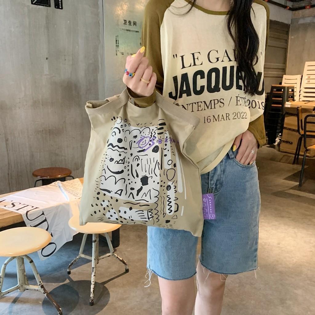 Stylish Canvas Tote Bag With Graffiti Print Large Capacity Shoulder Bag For Everyday Use