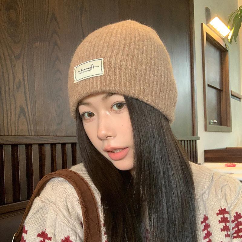 Simple cloth label wool wool hat women's autumn and winter comfortable cold hat outdoor cycling ear hat fashionable versatile knitted hat