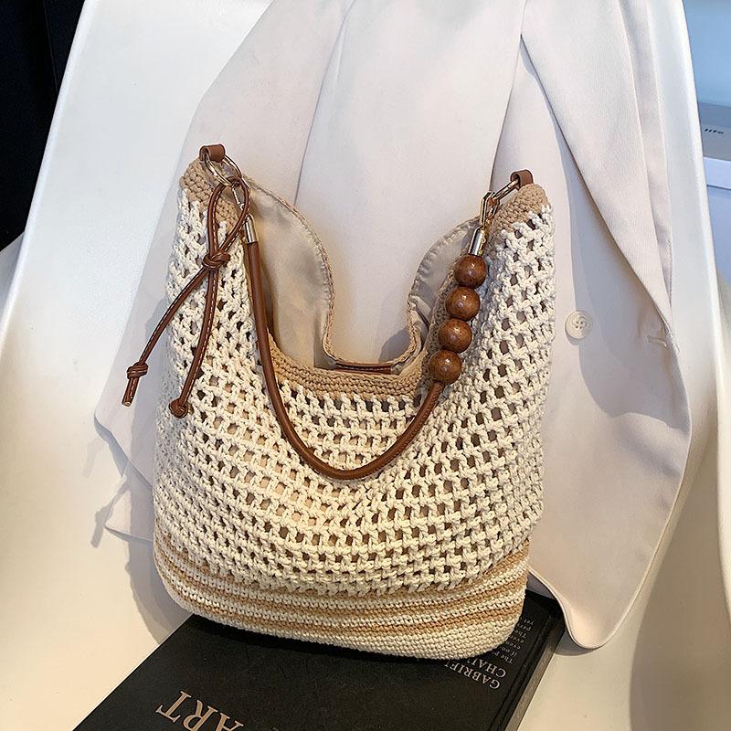 Tote bag women's 2025 new large-capacity commuter college students in class weaving soft hollow beach shoulder bag