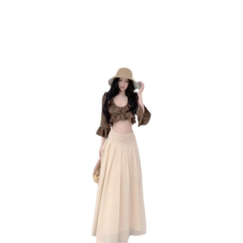 Yi Mengling has the same ruffle leaf edge v-neck long-sleeved shirt for women's summer vacation style temperament and thin a-word long skirt two-piece