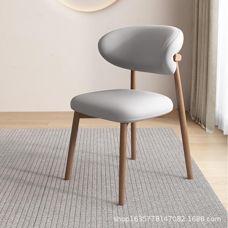 Nordic Modern Minimalist Solid Wood Dining Chair with Soft Pack Backrest - Comfortable Light Luxury Ram's Horn Design for Home, Restaurant, and Hotel.
