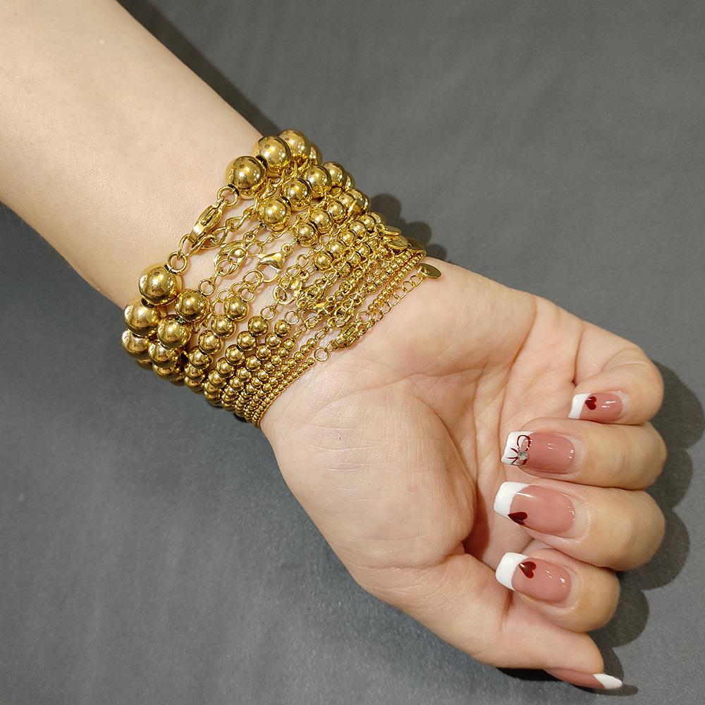 Bracelet Européen & Américain Minimaliste en Acier Inoxydable Élastique à Perles Dorées pour Femmes